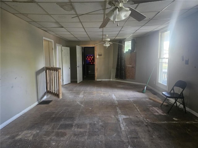 303 W Park St, Pittsburg, KS 66762 - unfurnished room with a ceiling fan, baseboards, and a paneled ceiling