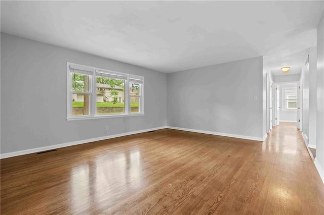 3218 NE 47th St, Kansas City, MO 64119 - unfurnished room featuring wood finished floors and baseboards