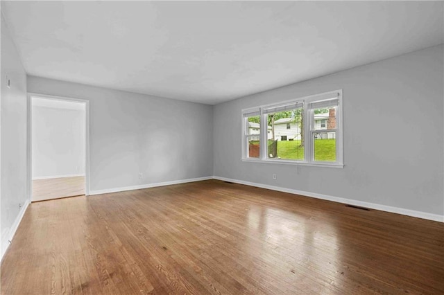 3218 NE 47th St, Kansas City, MO 64119 - empty room with wood finished floors and baseboards