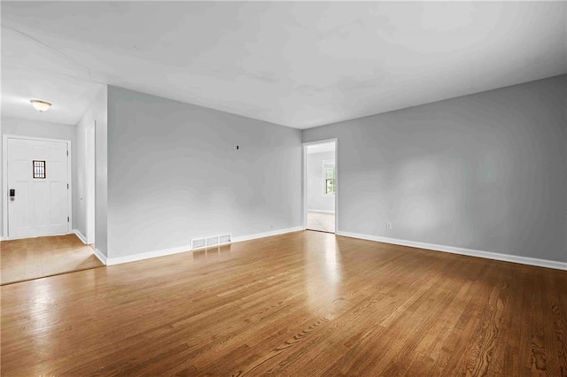 3218 NE 47th St, Kansas City, MO 64119 - spare room with wood finished floors and baseboards
