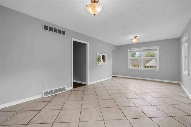 3218 NE 47th St, Kansas City, MO 64119 - unfurnished room with light tile patterned flooring and baseboards