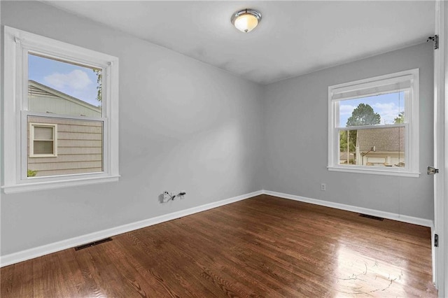 3218 NE 47th St, Kansas City, MO 64119 - unfurnished room featuring baseboards and wood finished floors