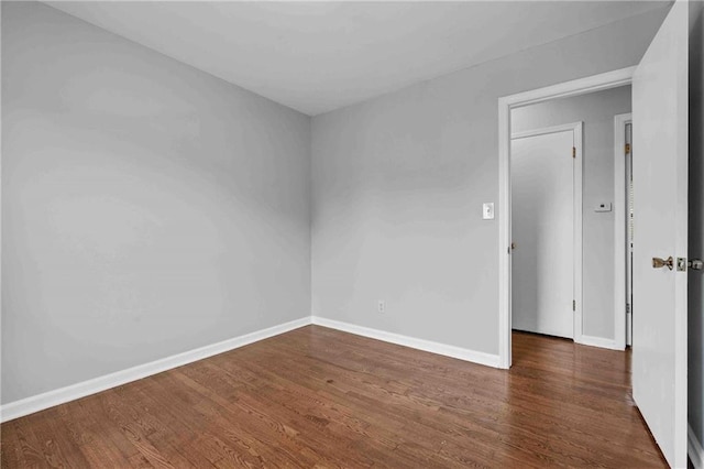 3218 NE 47th St, Kansas City, MO 64119 - empty room featuring wood finished floors and baseboards