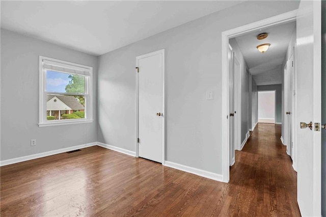 3218 NE 47th St, Kansas City, MO 64119 - unfurnished bedroom with wood finished floors and baseboards