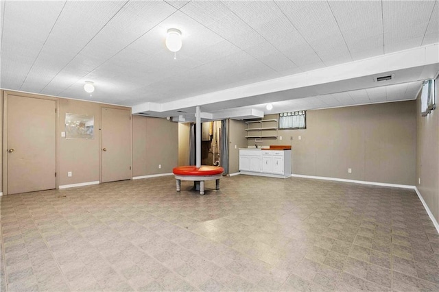 3218 NE 47th St, Kansas City, MO 64119 - finished basement featuring baseboards and light flooring