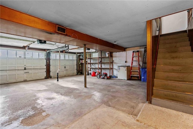 3218 NE 47th St, Kansas City, MO 64119 - garage featuring a garage door opener