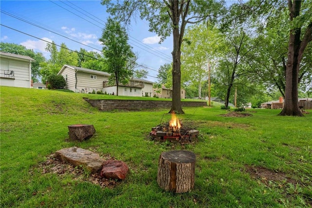 3218 NE 47th St, Kansas City, MO 64119 - view of green lawn featuring an outdoor fire pit