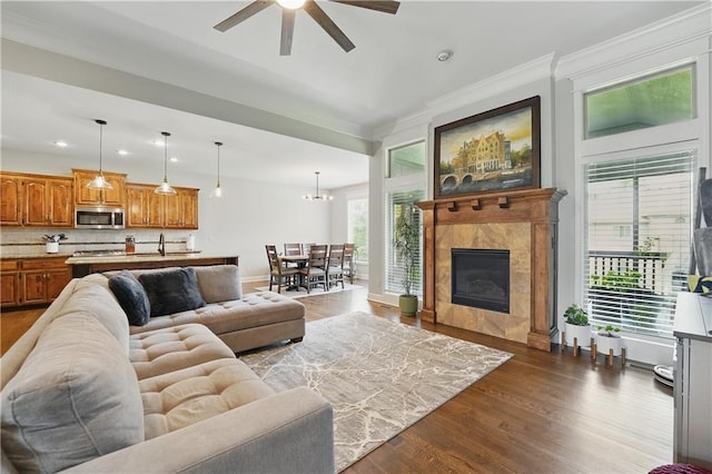 1104 NW 109th St, Kansas City, MO 64155 - living area featuring dark wood-style flooring, ceiling fan, recessed lighting, ornamental molding, and baseboards