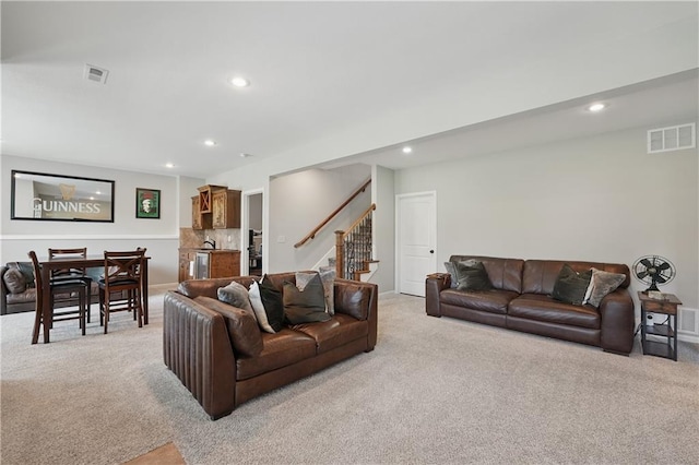 1104 NW 109th St, Kansas City, MO 64155 - living room with light colored carpet, recessed lighting, stairway, and baseboards