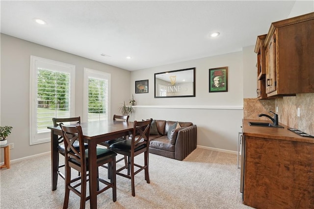 1104 NW 109th St, Kansas City, MO 64155 - dining space with light colored carpet, baseboards, and recessed lighting