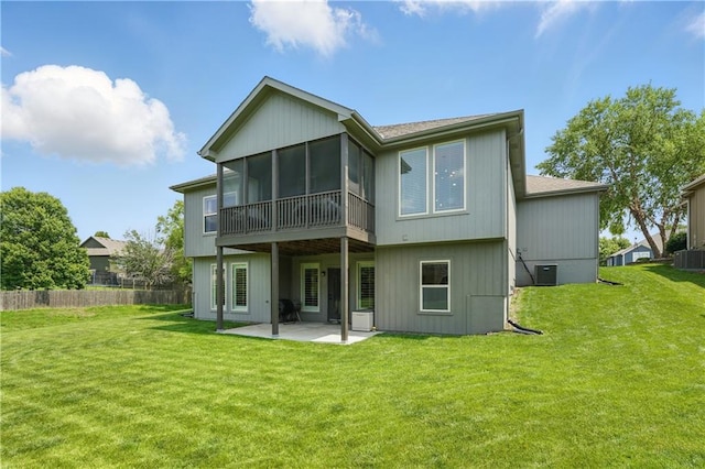 1104 NW 109th St, Kansas City, MO 64155 - rear view of property with a patio area, a sunroom, central AC, and a shingled roof