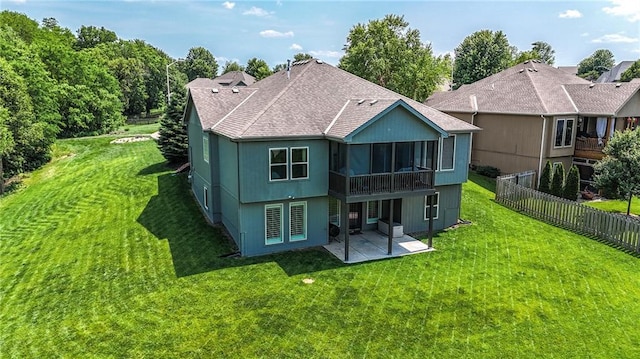 1104 NW 109th St, Kansas City, MO 64155 - back of house with a patio area, roof with shingles, and a sunroom