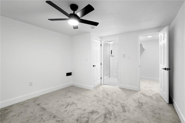 1419 Washington Blvd, Kansas City, KS 66102 - unfurnished bedroom featuring a walk in closet, carpet flooring, baseboards, ceiling fan, and a closet