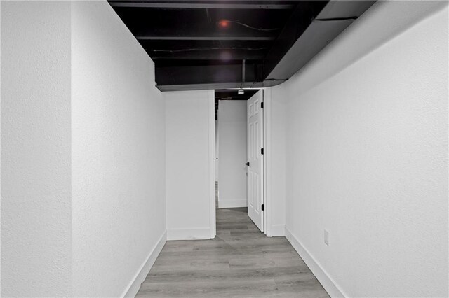 1419 Washington Blvd, Kansas City, KS 66102 - finished basement featuring light wood-style floors and baseboards