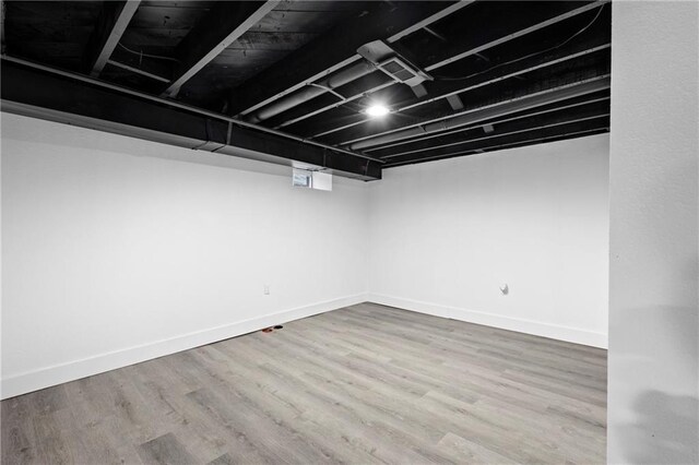 1419 Washington Blvd, Kansas City, KS 66102 - finished below grade area featuring wood finished floors and baseboards