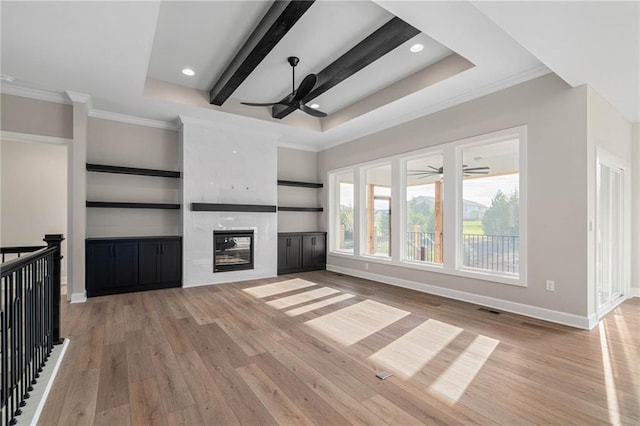14278 S Houston St, Olathe, KS 66061 - unfurnished living room with ceiling fan, light wood-style floors, ornamental molding, baseboards, and a premium fireplace