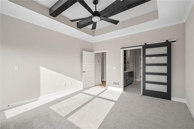 14278 S Houston St, Olathe, KS 66061 - spare room featuring a barn door, light carpet, ceiling fan, baseboards, and crown molding