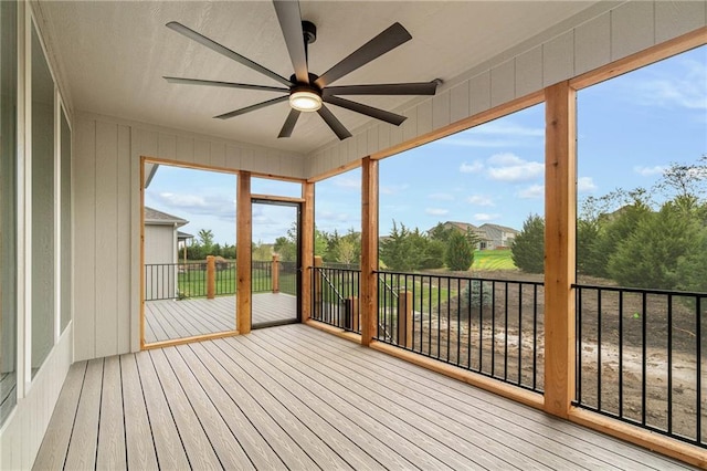 14278 S Houston St, Olathe, KS 66061 - unfurnished sunroom with ceiling fan, wood finished floors, and a deck
