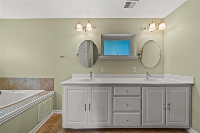 2306 Red Bridge Ter, Kansas City, MO 64131 - bathroom with double vanity and a tub to relax in