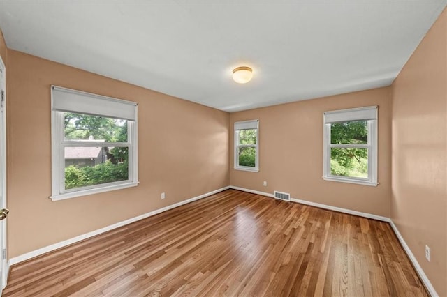 2306 Red Bridge Ter, Kansas City, MO 64131 - empty room with wood finished floors and baseboards