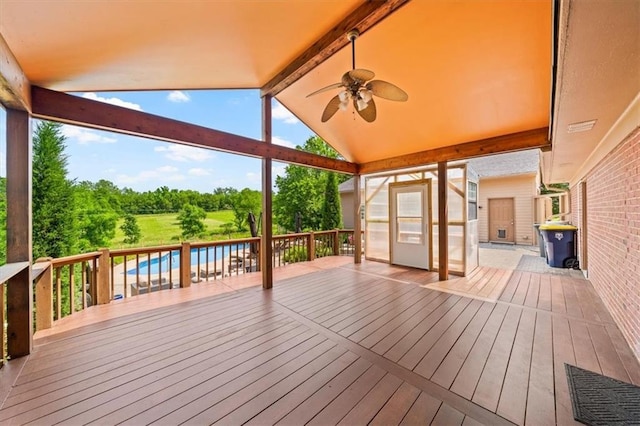 2306 Red Bridge Ter, Kansas City, MO 64131 - deck featuring a ceiling fan and view of wooded area