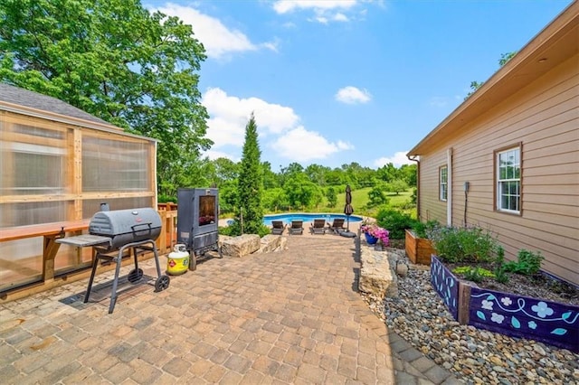 2306 Red Bridge Ter, Kansas City, MO 64131 - view of patio featuring an outdoor pool and a grill
