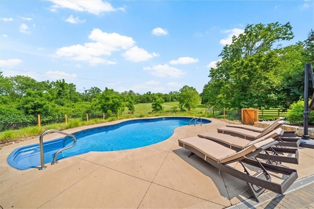 2306 Red Bridge Ter, Kansas City, MO 64131 - swimming pool with a patio area and view of scattered trees