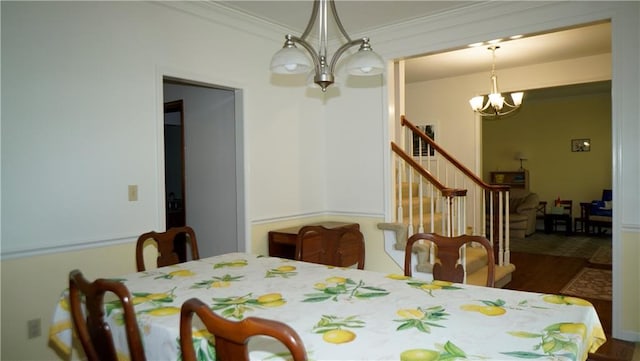 5500 NW 62nd St, Kansas City, MO 64151 - dining area with a chandelier, stairway, and ornamental molding