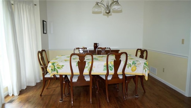 5500 NW 62nd St, Kansas City, MO 64151 - dining area with a chandelier, wood finished floors, and baseboards