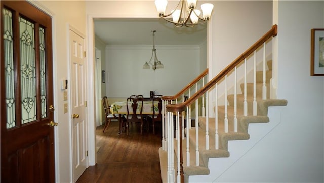 5500 NW 62nd St, Kansas City, MO 64151 - foyer entrance with a chandelier, dark wood-style floors, stairway, and ornamental molding