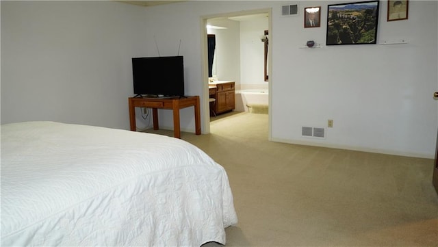 5500 NW 62nd St, Kansas City, MO 64151 - bedroom with light colored carpet and ensuite bathroom