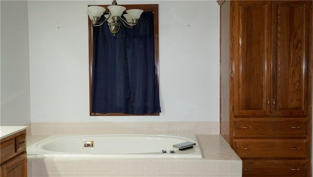 5500 NW 62nd St, Kansas City, MO 64151 - full bath featuring vanity, a bath, and a chandelier