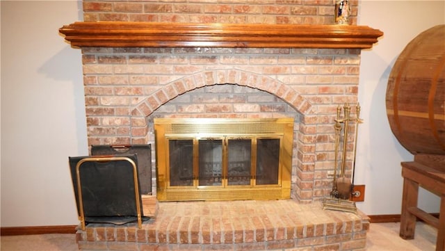 5500 NW 62nd St, Kansas City, MO 64151 - detailed view of a brick fireplace, carpet flooring, and baseboards
