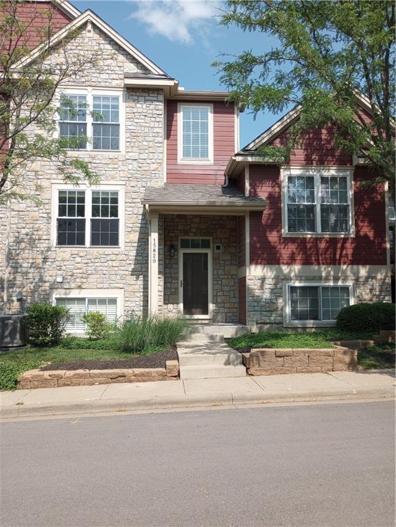15829 W Robinson St, Overland Park, KS 66223 - view of front of home featuring stone siding