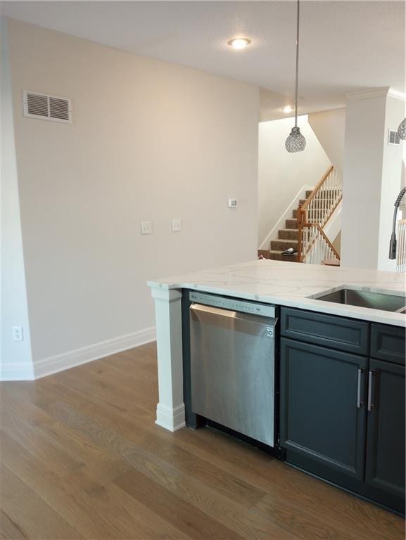 15829 W Robinson St, Overland Park, KS 66223 - kitchen featuring stainless steel dishwasher, a sink, wood finished floors, baseboards, and decorative light fixtures