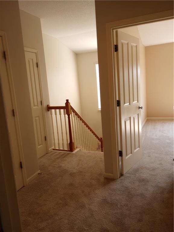 15829 W Robinson St, Overland Park, KS 66223 - corridor featuring an upstairs landing, carpet, and baseboards