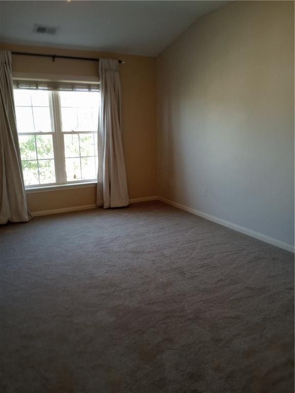 15829 W Robinson St, Overland Park, KS 66223 - carpeted spare room with baseboards and lofted ceiling