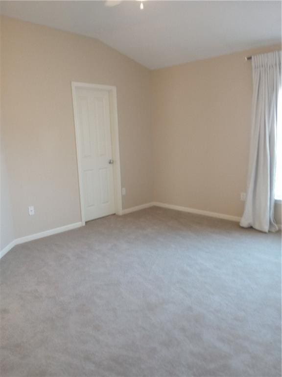 15829 W Robinson St, Overland Park, KS 66223 - carpeted empty room featuring baseboards and vaulted ceiling