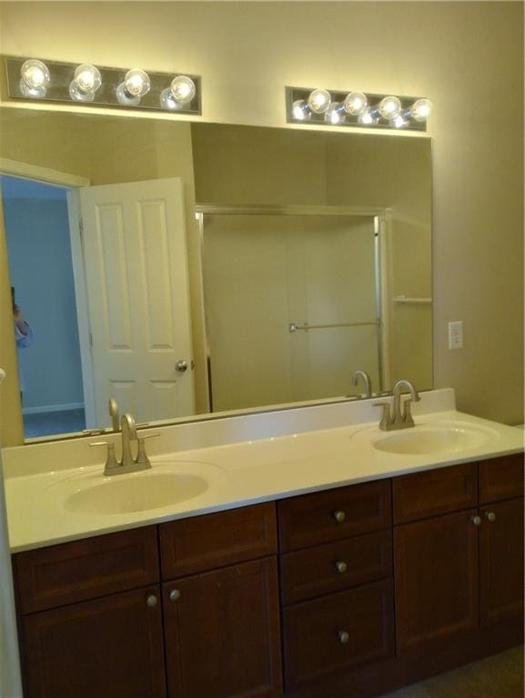 15829 W Robinson St, Overland Park, KS 66223 - full bathroom featuring double vanity and an enclosed shower
