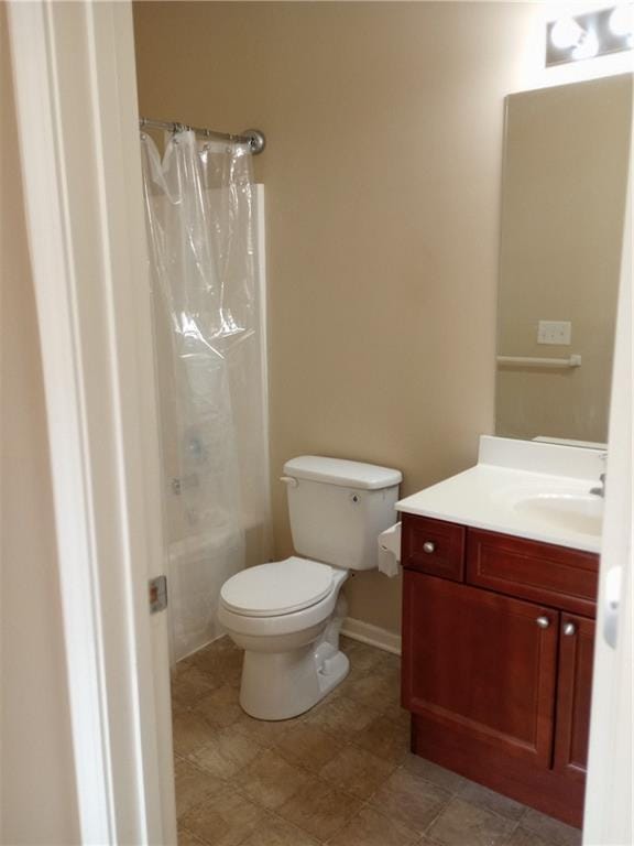 15829 W Robinson St, Overland Park, KS 66223 - bathroom with vanity, shower / tub combo, toilet, and baseboards