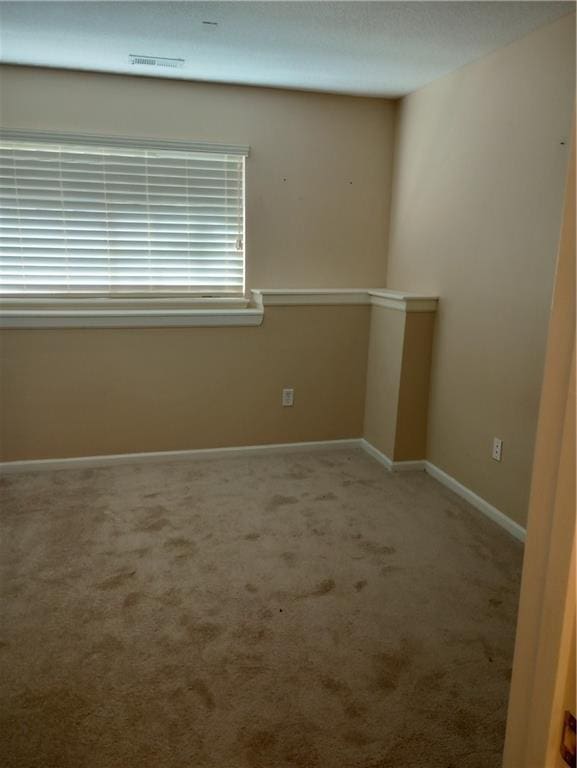 15829 W Robinson St, Overland Park, KS 66223 - carpeted empty room with baseboards