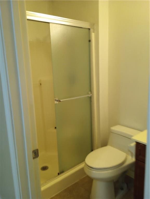 15829 W Robinson St, Overland Park, KS 66223 - full bathroom with toilet, vanity, a shower stall, and tile patterned floors