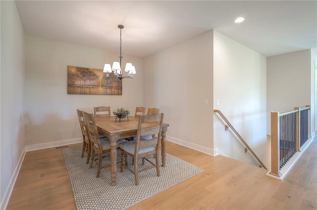 24129 W 95th St, Lenexa, KS 66227 - dining space with a chandelier, light wood-style floors, baseboards, and recessed lighting