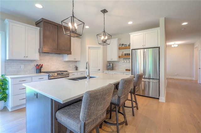 24129 W 95th St, Lenexa, KS 66227 - kitchen with stainless steel appliances, open shelves, a sink, tasteful backsplash, and light countertops