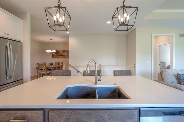 24129 W 95th St, Lenexa, KS 66227 - kitchen featuring a chandelier, a sink, stainless steel appliances, recessed lighting, and hanging light fixtures