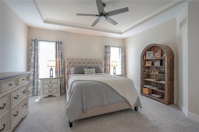 24129 W 95th St, Lenexa, KS 66227 - bedroom with a tray ceiling, multiple windows, light carpet, and ceiling fan