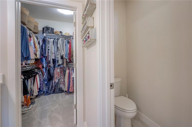 24129 W 95th St, Lenexa, KS 66227 - bathroom with toilet, a spacious closet, and baseboards