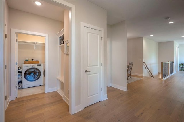 24129 W 95th St, Lenexa, KS 66227 - corridor featuring an upstairs landing, light wood-style floors, recessed lighting, independent washer and dryer, and baseboards