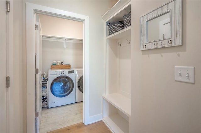 24129 W 95th St, Lenexa, KS 66227 - laundry area featuring separate washer and dryer, light wood-type flooring, and baseboards