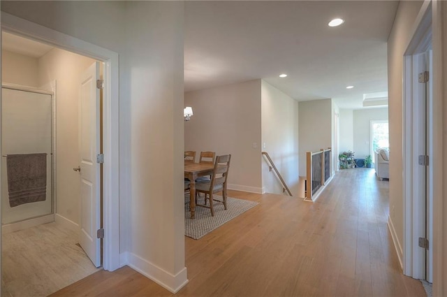 24129 W 95th St, Lenexa, KS 66227 - corridor with light wood finished floors, an upstairs landing, recessed lighting, and baseboards